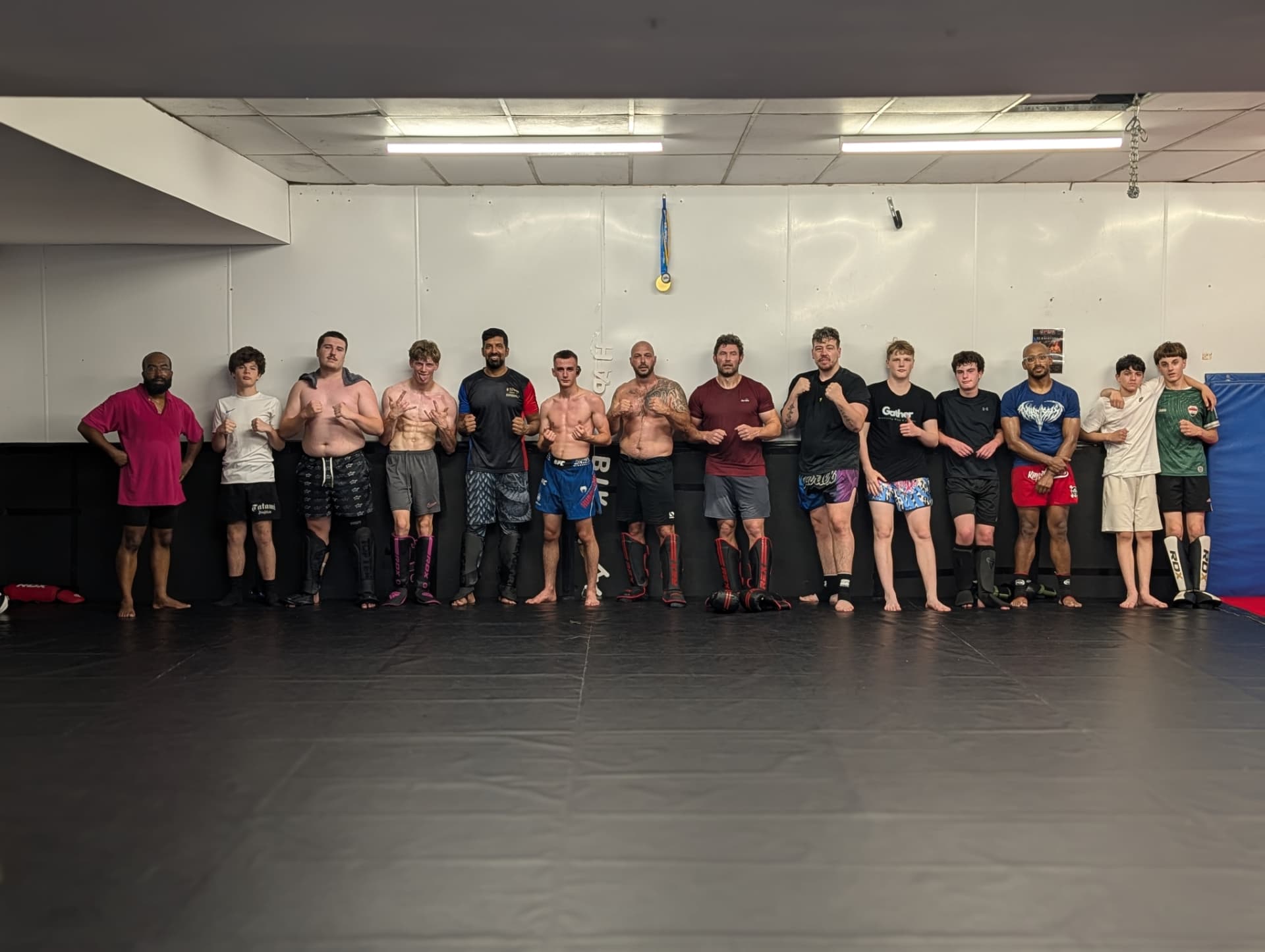 Members of 6 Towns Grappling and Namahage Fight Club lined up on the mats
